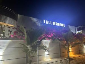 a building with a sign that reads sidx resistance at Appartement Somone , Sall Residence in Mbour