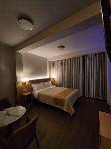 Ένα ή περισσότερα κρεβάτια σε δωμάτιο στο Hotel Alba +84 φωτογραφίες