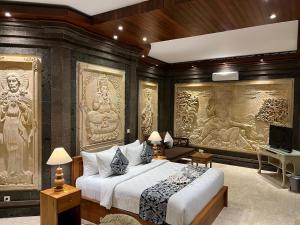 Ένα ή περισσότερα κρεβάτια σε δωμάτιο στο Arbathu Villa Ubud +78 φωτογραφίες