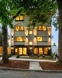 a building with lights on the side of it at The Adelynn 5BR - Sleek - Spacious - Walkable in Portland