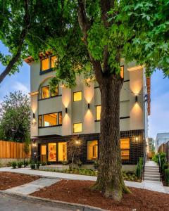 a building with a tree in front of it at The Adelynn 5BR - Sleek - Spacious - Walkable in Portland
