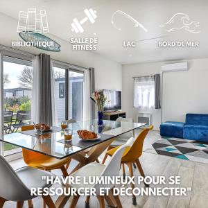 a dining room with a glass table and chairs at Havre lumineux pour se ressourcer et déconnecter - Bord de mer in Sainte-Foy