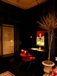 a room with a table and a potted plant at DEMO Inn & Ine - Poetic Studio Stay by ATV in Hanoi