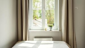Postel nebo postele na pokoji v ubytování Vilnius Private Stay