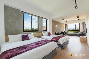 Ένα ή περισσότερα κρεβάτια σε δωμάτιο στο 幸福時潮旅宿本館l宜蘭包棟民宿依人數開房