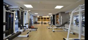 a gym with lots of treadmills and machines at Loft Alto padrão na beira mar de Tambaú in João Pessoa