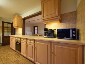 Kuchyň nebo kuchyňský kout v ubytování Holiday Home in Rogery with Sauna