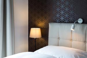 Postel nebo postele na pokoji v ubytování Hotel Villa Solln