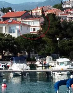a group of boats are docked in a marina at Apartmani Totić in Crikvenica