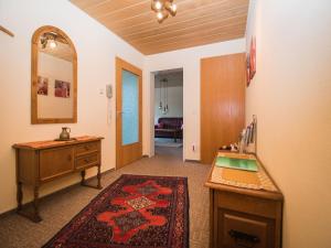 a room with a desk and a sink and a mirror at Ferienwohnung Matteit in Bad Peterstal