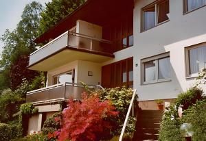 a house with a staircase in front of it at Ferienwohnung Matteit in Bad Peterstal