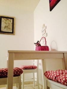 a table with two stools and two bags on it at Bellus Apartment-COMPLETELY RENOVATED in Split