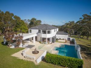 an aerial view of a house with a swimming pool at La La Land by Coast Hosting in Tascott