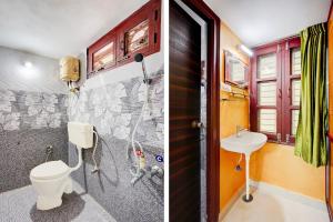 a bathroom with a toilet and a sink at Super Hotel O Chittoor Railway Station Formerly Four Oaks in Chittoor