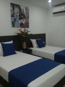 Postel nebo postele na pokoji v ubytování Massay Hotel