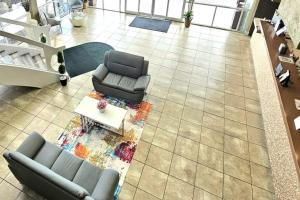 an overhead view of a living room with a couch and a table at Quality Inn & Suites Conference Center in New Port Richey