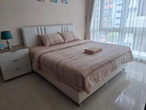 Postel nebo postele na pokoji v ubytování Grand avenue condo Soi Boaukow + 8 fotografií