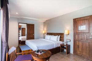 Postel nebo postele na pokoji v ubytování Carunda Hotel Pattaya