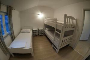 Postel nebo postele na pokoji v ubytování Apartments Leut