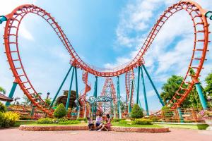 a roller coaster at a theme park at SK Village in Ban Baen Phichit +16 photos