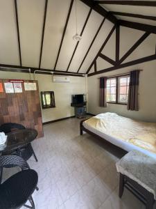 En eller flere senge i et værelse på Koh Yor Resort เกาะยอรีสอร์ท