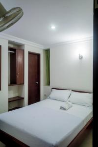 Postel nebo postele na pokoji v ubytování Hotel Preferencial Class