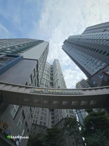 a view of a building with a train on a bridge at BAAN BUSAN#Haeundae Sea View in Busan