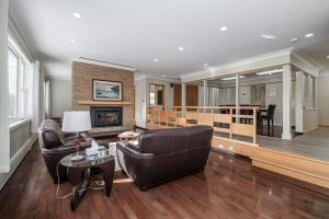 a living room with a couch and a table at 3 Bed 2 Bath Retro-Chic Comfort on the Crescent in St. John's