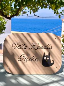 a sign that says villa maria autoria with a black cat at "Villa Kanella"Sea View Hydra Kamini malouholidays in Hydra