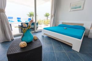 A bed or beds in a room at Villa Amateia