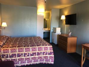 Letto o letti in una camera di Applegate Inn