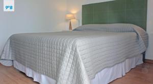 Кровать или кровати в номере Torre Alberti Apartments