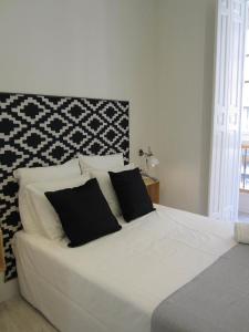 Cama o camas de una habitación en Livemalaga Santa María Apartments