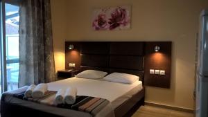 A bed or beds in a room at Apartments Palladium
