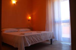 Postel nebo postele na pokoji v ubytování B&B La Cantoniera