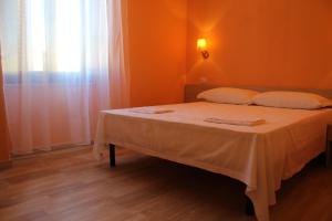 Postel nebo postele na pokoji v ubytování B&B La Cantoniera
