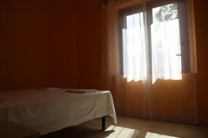 Postel nebo postele na pokoji v ubytování B&B La Cantoniera