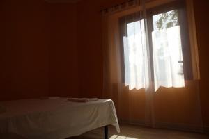 Postel nebo postele na pokoji v ubytování B&B La Cantoniera