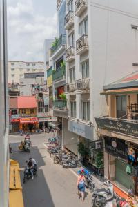 a group of motorcycles parked on a street next to buildings at Sword Lake Hostel and Spa in Hanoi