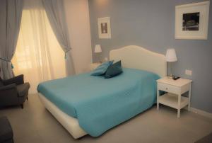 A bed or beds in a room at Rome Together Guest House