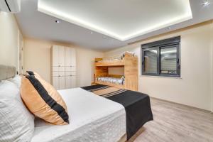 a bedroom with a bed and a window at Modern Villa Private Pool 10 min to Kleopatra Beach in Kozyaka +19 photos