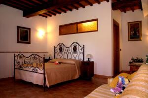 Posteľ alebo postele v izbe v ubytovaní SassoMatto b&b BioAgrituRelax