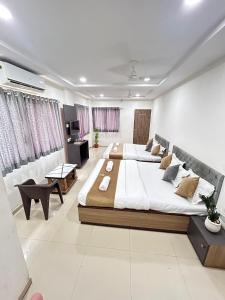 a large bedroom with a large bed in a room at S R Hotel in Jāmb