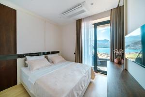 Postel nebo postele na pokoji v ubytování Bellemond Hotel & Residences + 81 fotografií