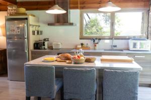 a kitchen with a table with food on it at Les Planes de Viladrau in Viladrau
