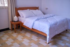 Ένα ή περισσότερα κρεβάτια σε δωμάτιο στο Elegant Dar Suburb Hideaway