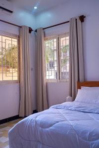 Ένα ή περισσότερα κρεβάτια σε δωμάτιο στο Elegant Dar Suburb Hideaway