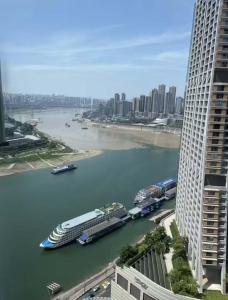 a cruise ship in a river in a city at Tianya Wuxi river Hotel (Jiefangbei ) in Nan'an +66 photos