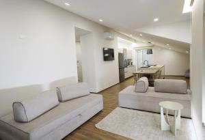 a living room with a couch and a table at Terrazza Belvedere in Melfi