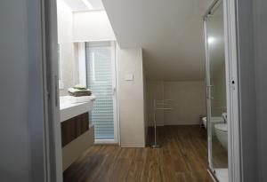 a bathroom with a toilet and a sink and a shower at Terrazza Belvedere in Melfi +24 photos